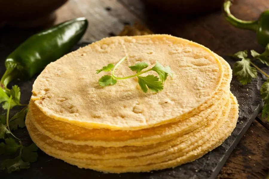 How do you heat corn tortillas without breaking them?