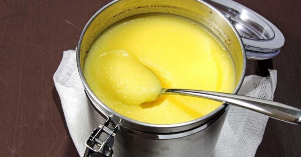Making ghee by churning butter