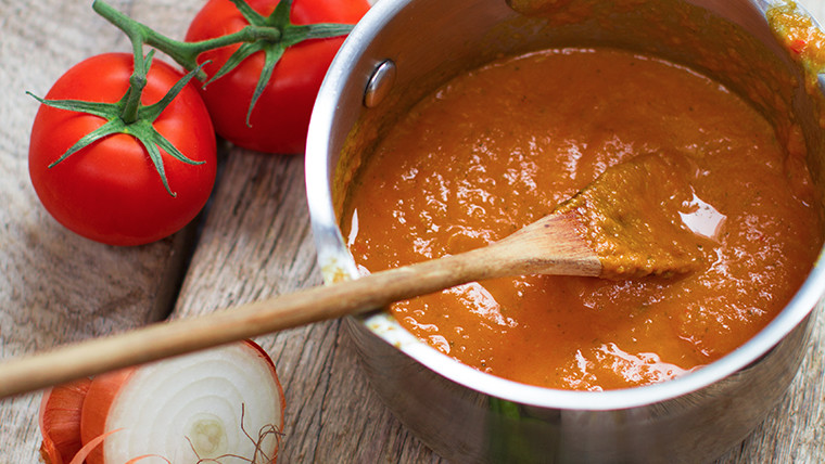 Making a sauce base with onion and tomato