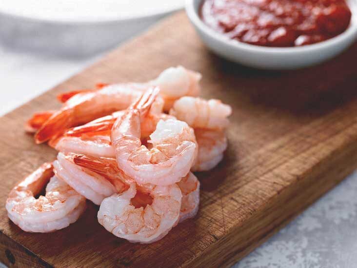 Is it possible to consume shrimp that hasn't been thoroughly cooked?