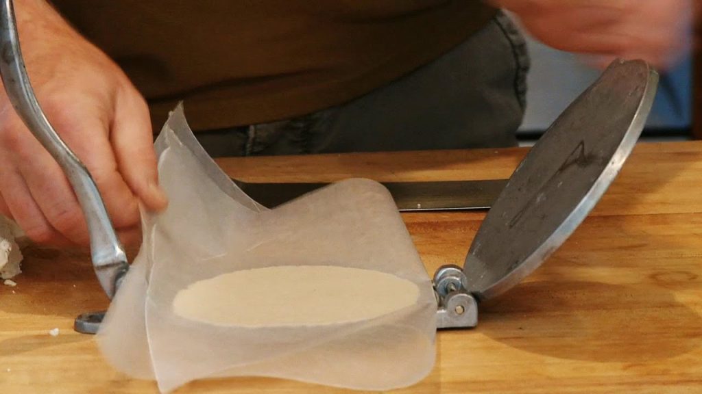 What is the best way to keep tortillas from sticking to the press?