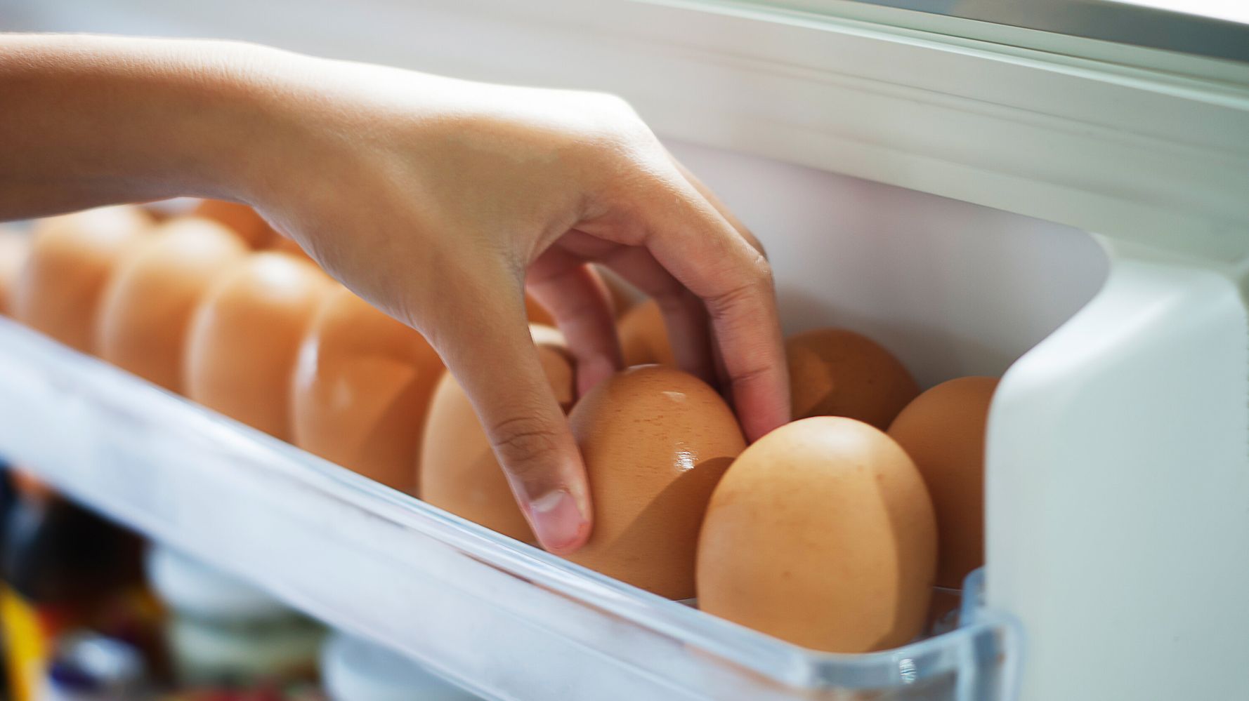 Is it better to store boiled eggs peeled or unpeeled within the refrigerator?