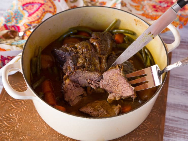 Without a thermometer, how can you tell if pot roast is done?
