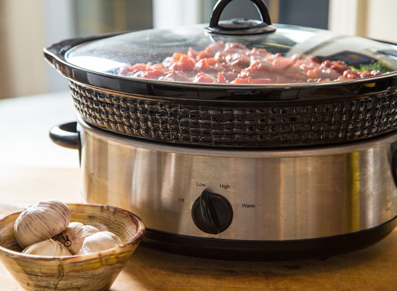 Is it necessary to submerge the meat in a slow cooker