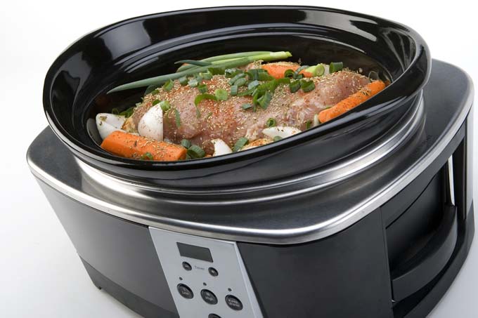 When should you add fresh herbs to a slow cooker?