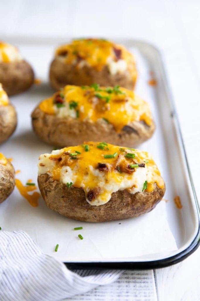 What are the signs that baked potatoes are done?