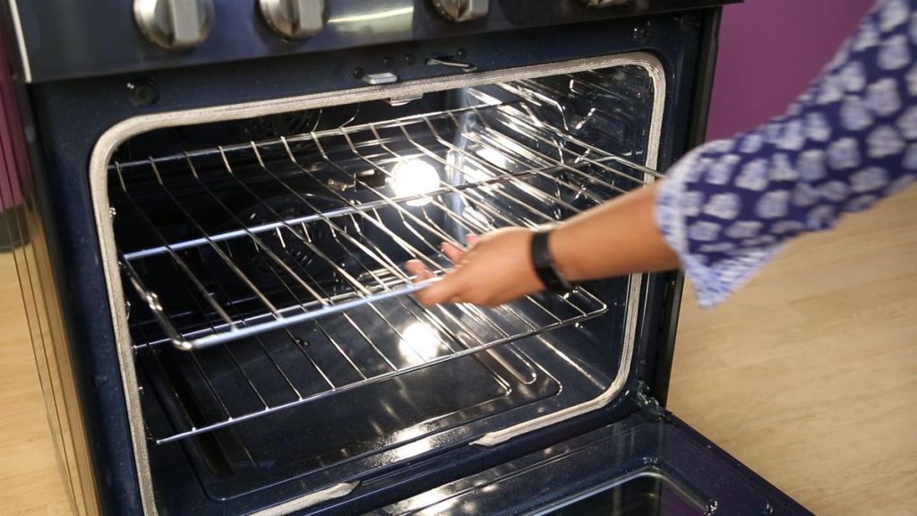 Why does my oven have a burning plastic odour?