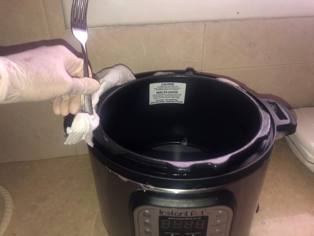 What is the best way to clean the lid of an Instant Pot?