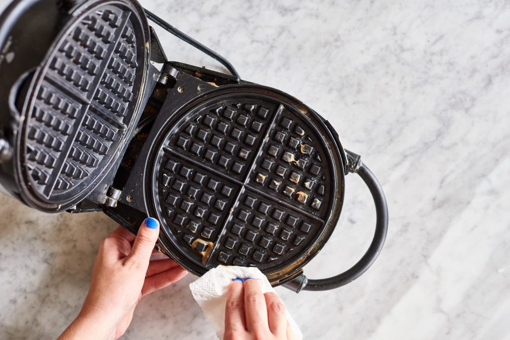 What's the correct way to clean a sticky waffle iron?