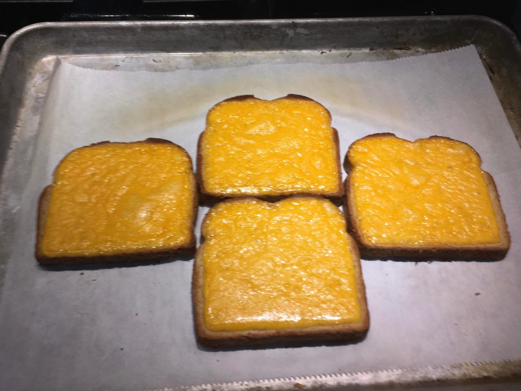 An open-faced grilled cheese sandwich