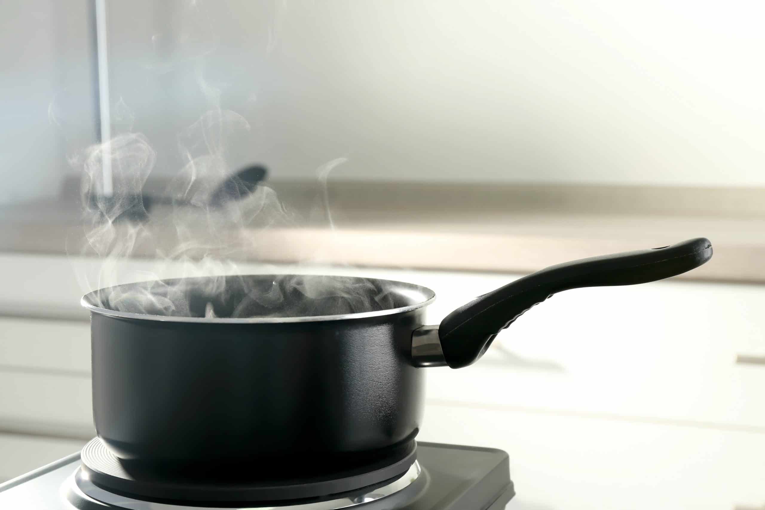 When a Saucepan is placed on the stove, why does the handle become hot?
